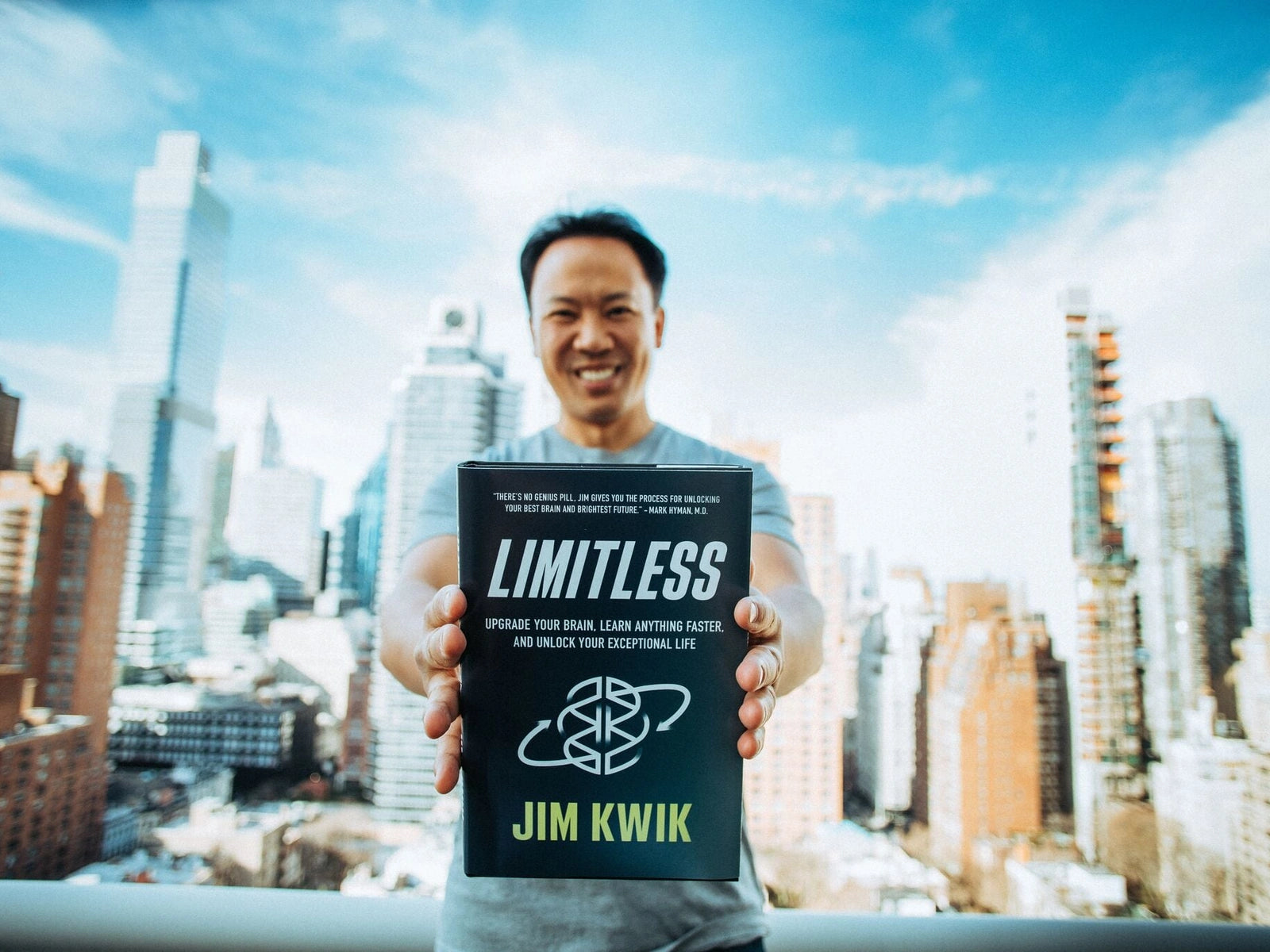 Jim Kwik holding his book Limitless